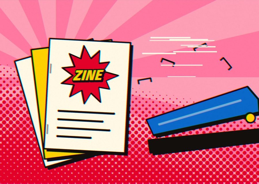 A stack of folded zines beside a blue stapler, with staples flying